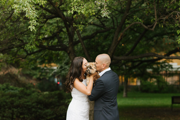 a couple holding their favourite puppy during their engagement session