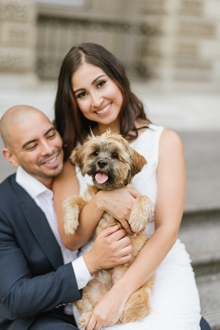 happy dog and her bride and groom