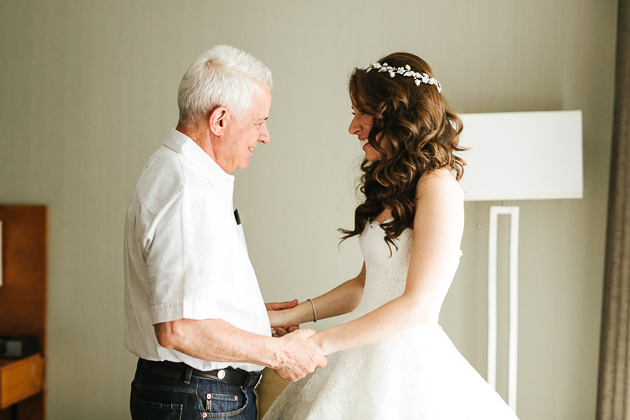 Father-of-the-bride sees his daughter as a bride on the morning of the wedding