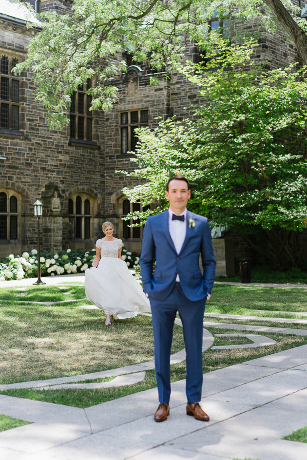 A bride walking towards her husband-to-be for their First Look at the U of T