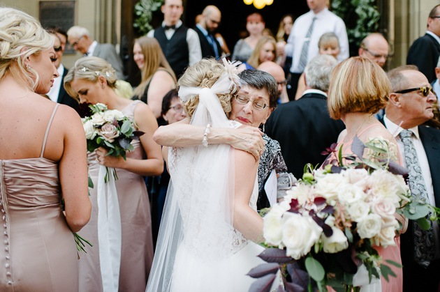 A mother gives a bride a hug during their wedding in Calgary