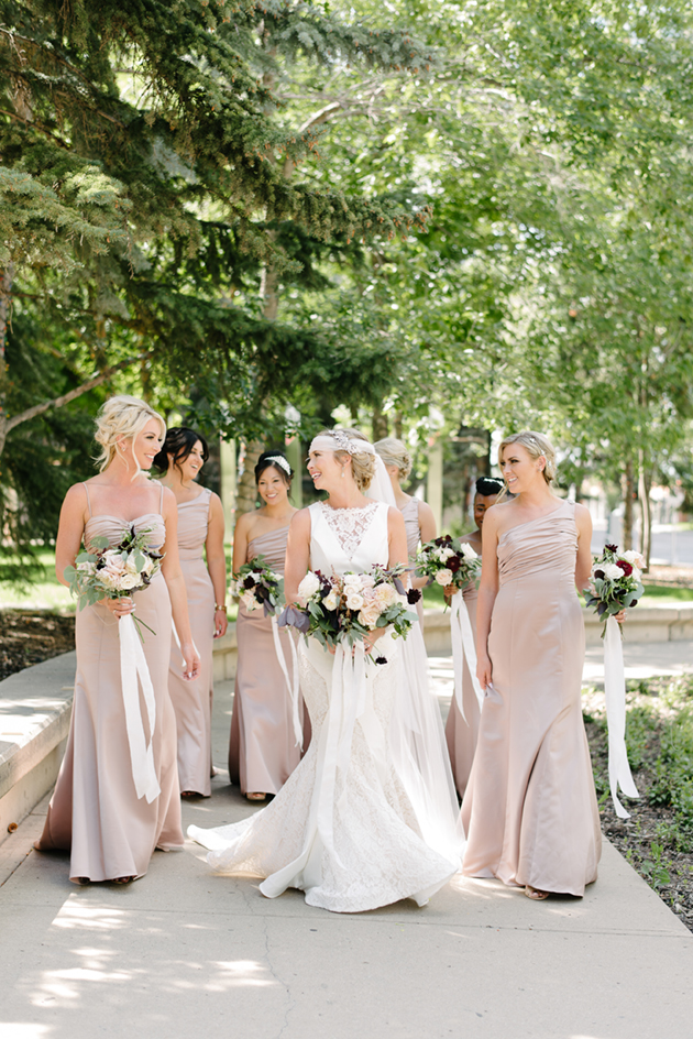 Bridesmaids wore dust pink dresses at this Great Gatsby themed wedding