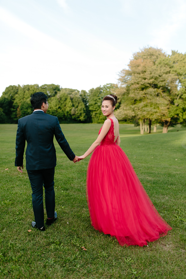 This bride rocked a red wedding dress for her wedding reception at the Estates of Sunnybrook