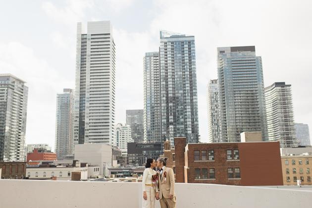 A bride and groom wearing a Thai traditional wedding attire on a Toronto rooftop wedding photos