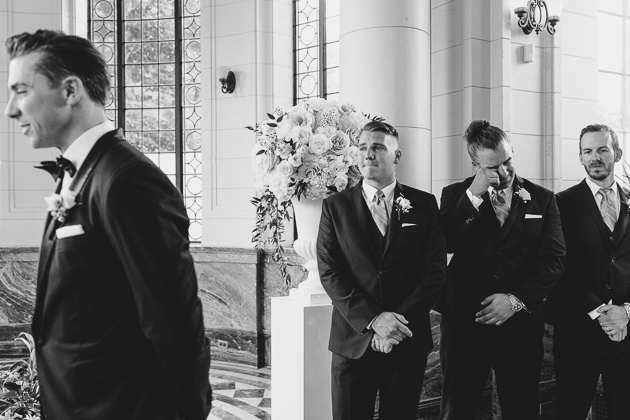 Groomsmen reaction to the bride walking down the aisle 