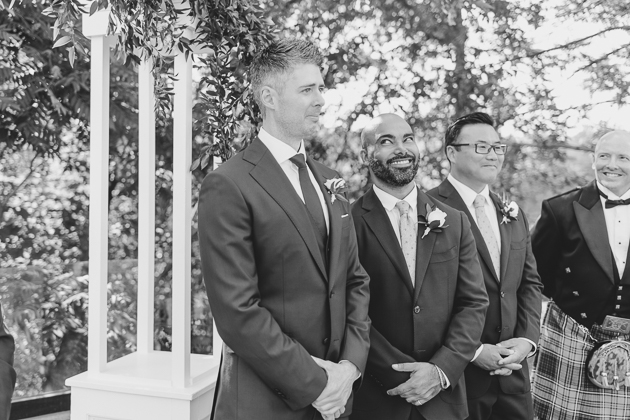 Groomsmen's reaction to the bride walking down the aisle 