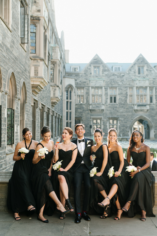 A groom with bridesmaids at the Hart House wedding