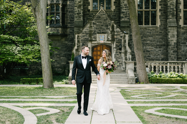 A bride and groom enjoying a stroll at Trinity College